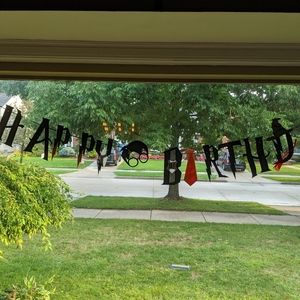 Harry Potter birthday banner and cake decorations